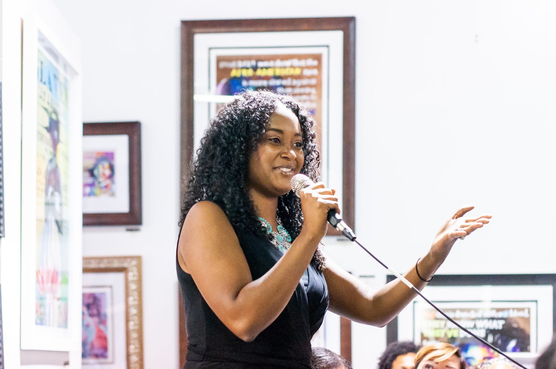A speaker addressing the room with warmth and conviction