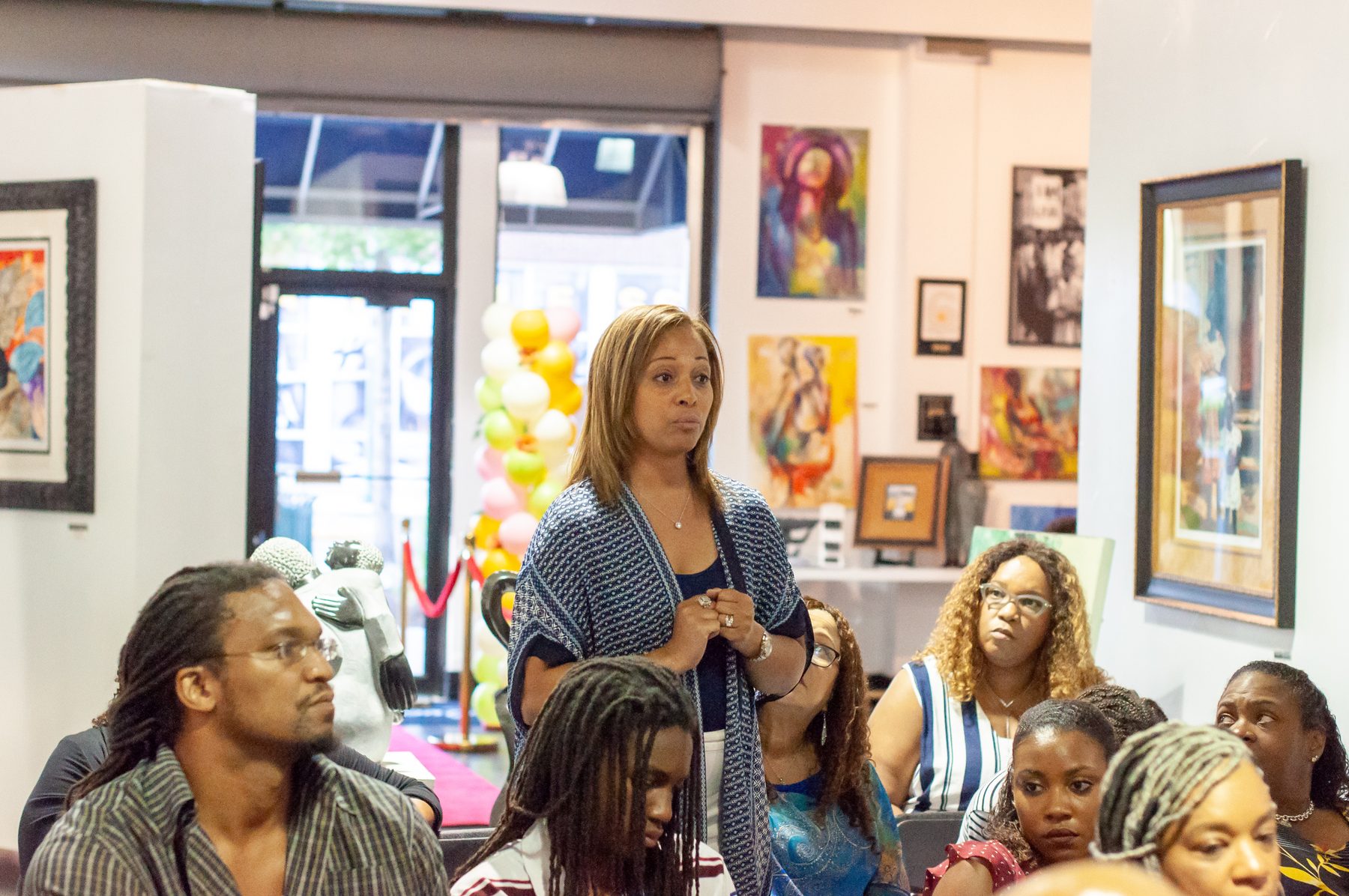 A guest standing to speak during the community conversation