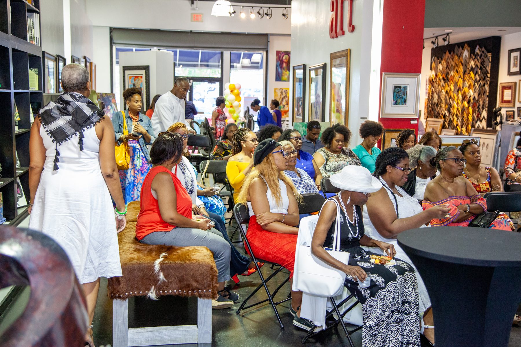 The full gallery filled with women who came out