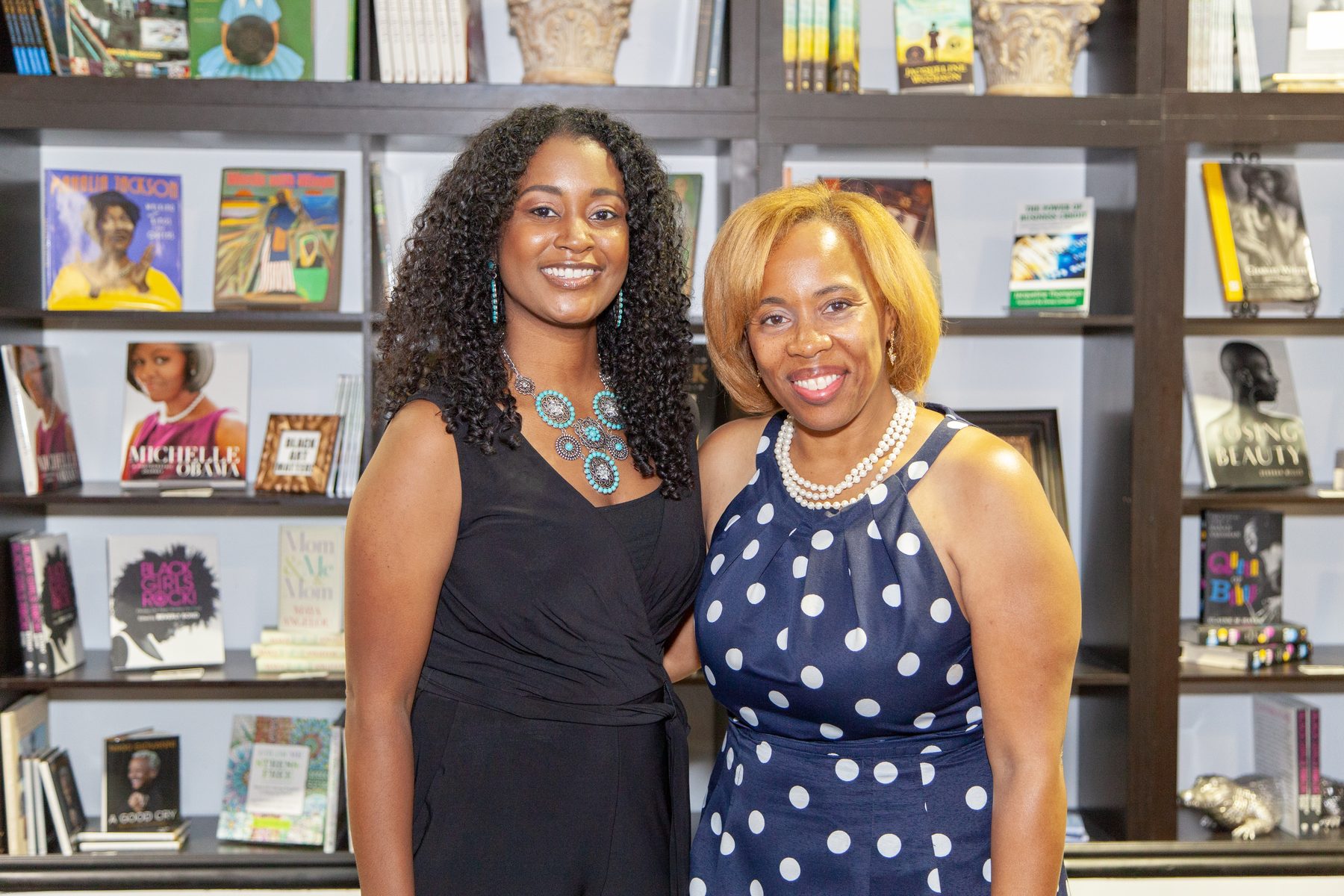 Angela Terrell and a younger guest, one generation welcoming the next